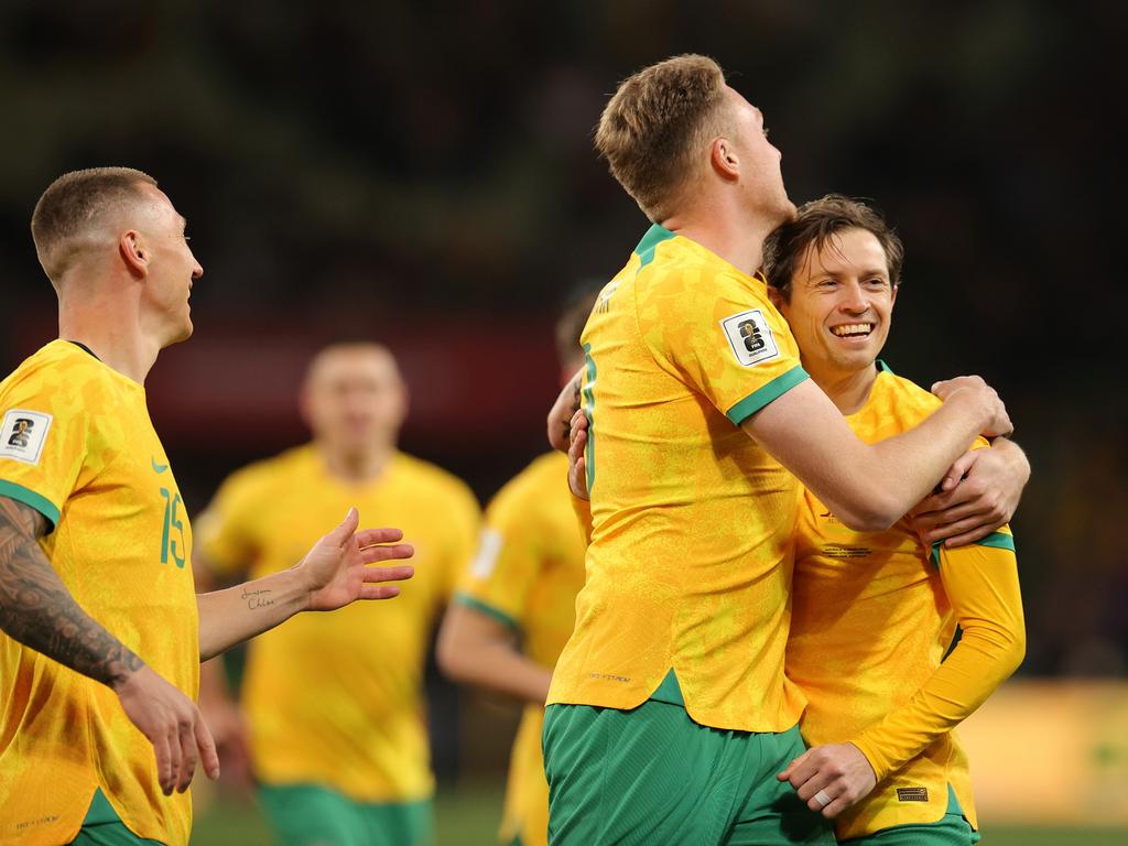 Craig Goodwin (right) celebrates with Harry Souttar during the Socceroos’ win over Bangladesh. Picture: Kelly Defina/Getty Images
