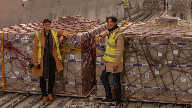 Kristy Carr, chief executive of Bubs Australia, and Bubs chairman Dennis Lin with boxes of Bubs baby formula being loaded into a cargo plane bound for the US at Melbourne Airport. Picture: Asanka Ratnayake/Getty Images