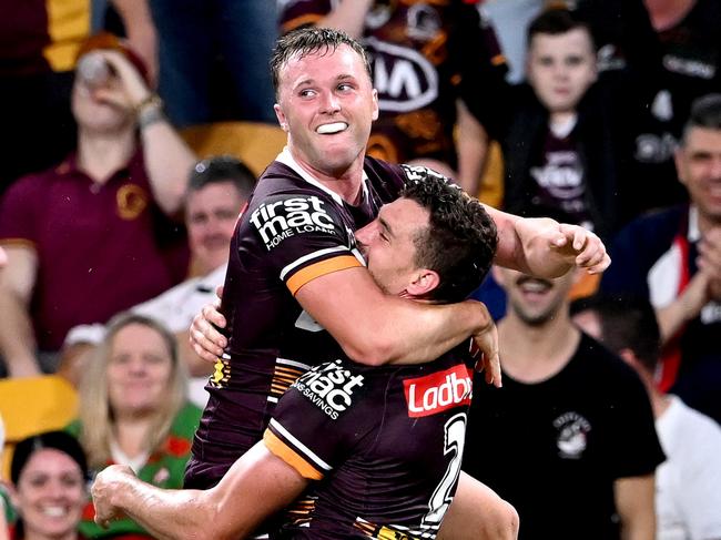 BRISBANE, AUSTRALIA - MARCH 11: Corey Oates of the Broncos celebrates with team mates Jake Turpin of the Broncos after scoring a try during the round one NRL match between the Brisbane Broncos and the South Sydney Rabbitohs at Suncorp Stadium, on March 11, 2022, in Brisbane, Australia. (Photo by Bradley Kanaris/Getty Images)