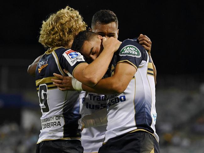 Wharenui Hawera of the Brumbies (centre) celebrates with team mates after scoring a try during the Round 3 Super Rugby match between the ACT Brumbies and the Western Force at GIO Stadium in Canberra, Friday, March 10, 2017. (AAP Image/Lukas Coch) NO ARCHIVING, EDITORIAL USE ONLY