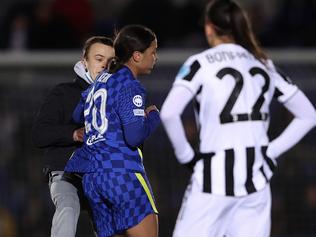 KINGSTON UPON THAMES, ENGLAND - DECEMBER 08: A pitch invader collides with Sam Kerr of Chelsea during the UEFA Women's Champions League group A match between Chelsea FC and Juventus at Kingsmeadow on December 08, 2021 in Kingston upon Thames, England. (Photo by Warren Little/Getty Images)