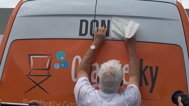 Don Leckenby unveils the Orange Sky Van that bears his name.