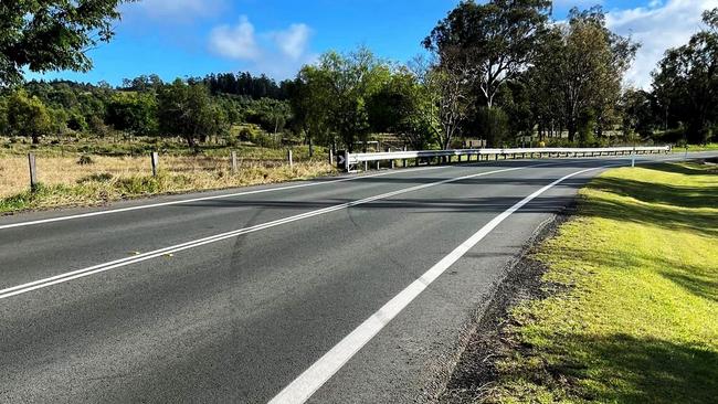 The bend was recently upgraded, however residents say the barrier was installed at a section of the road where crashes do not occur, rather than in front of light poles and homes just after the bend. Rosewood Karrabin Road. Picture: Facebook/Bruce Bennett