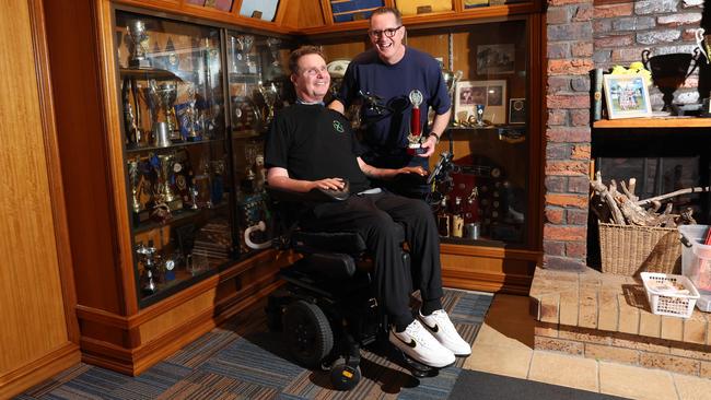 Quadraplegic Perry Cross, about to celebrate his 50th birthday, at Gold Coast Eagles clubhouse with best mate Damien Holley. Picture: Glenn Hampson