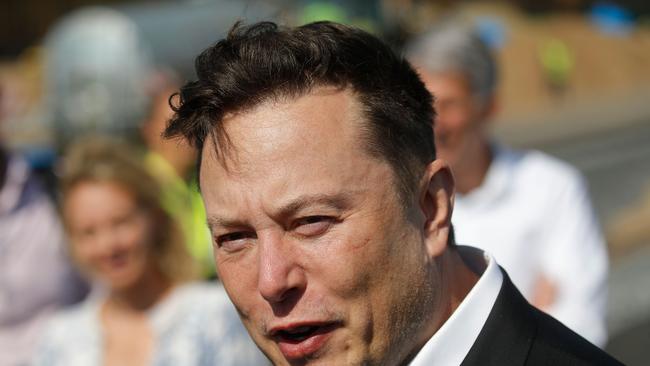 (FILES) In this file photo Tesla CEO Elon Musk talks to media as he arrives to visit the construction site of the future US electric car giant Tesla, on September 3, 2020 in Gruenheide near Berlin. (Photo by Odd ANDERSEN / AFP)