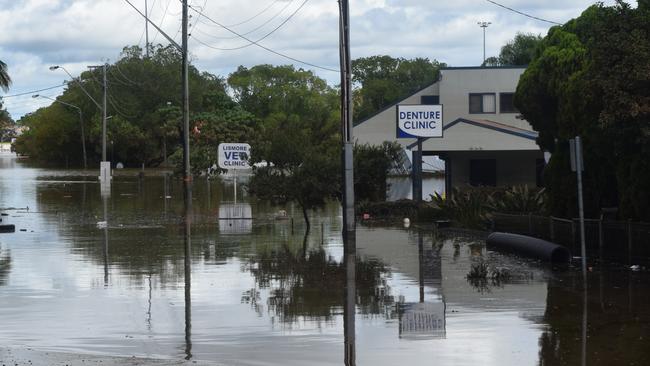 The VET clinic on Uralba Street is totally submerged with just the road sign sticking out of the water.