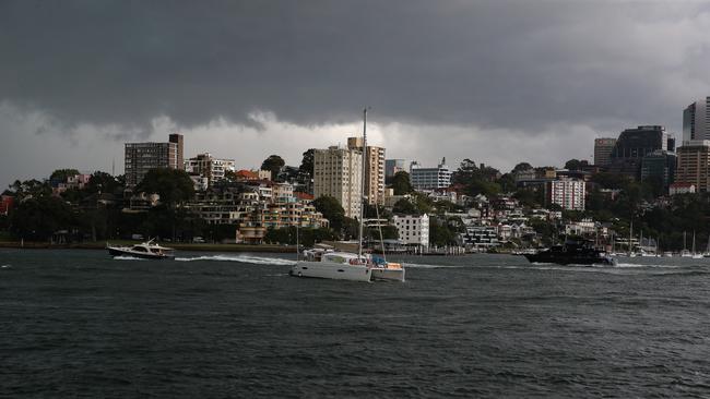 A view of Lavender Bay and Sydney Harbour from Hickson Road in the Rocks in Sydney as wet weather and storms hit Sydney again Wednesday.