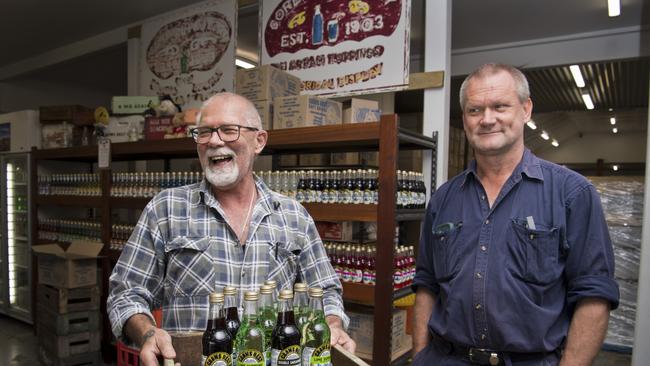 Crows Next Soft Drinks owner (from left) Alex Davidson and Murray Rosenberg are happy that Crows Nest is enjoying a tourist boom.