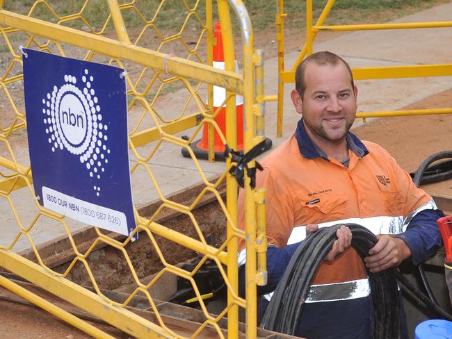 Trainee cable joiner Ewan Schmerl working on the National Broadband Network in Alice Springs.