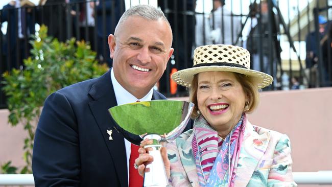 MELBOURNE, AUSTRALIA - OCTOBER 19: Trainer Gai Waterhouse poses with chairman of MRC John Kanga after Too Darn Lizzie won Race 6, the Manhari Thousand Guineas Prelude - Betting Odds  during Melbourne Racing at Caulfield Racecourse on October 19, 2024 in Melbourne, Australia. (Photo by Vince Caligiuri/Getty Images)