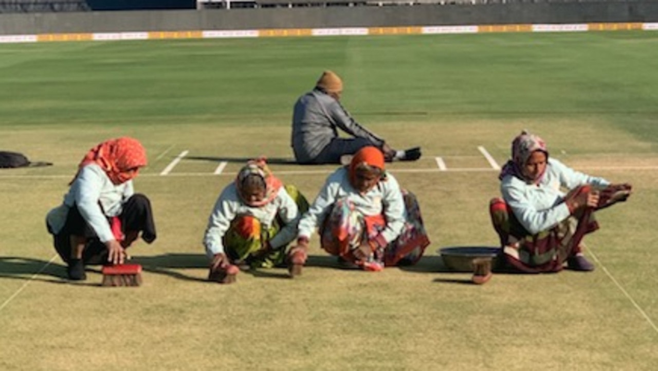 Four elderly ladies spent the morning on their hands and knees vigorously scrubbing grass clippings off the pitch.