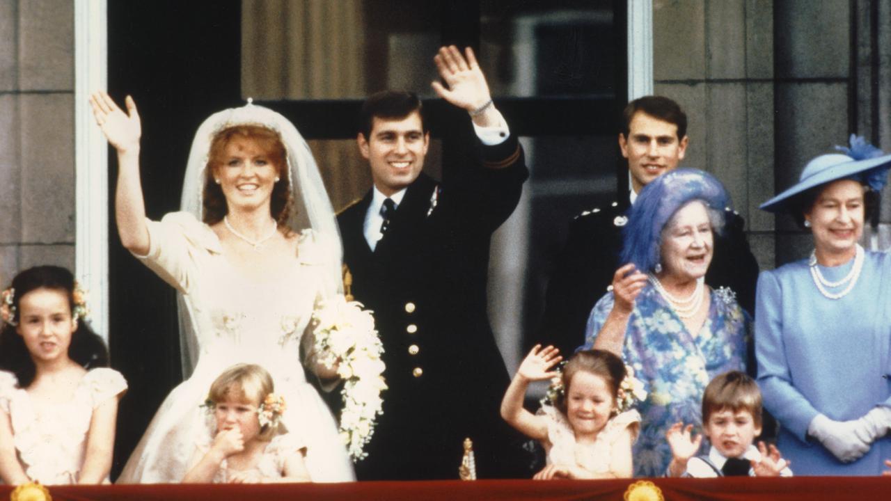 Newlyweds Sarah Ferguson and Prince Andrew on the balcony of Buckingham Palace after their wedding in 1986. Picture: STRINGER/PA/AFP