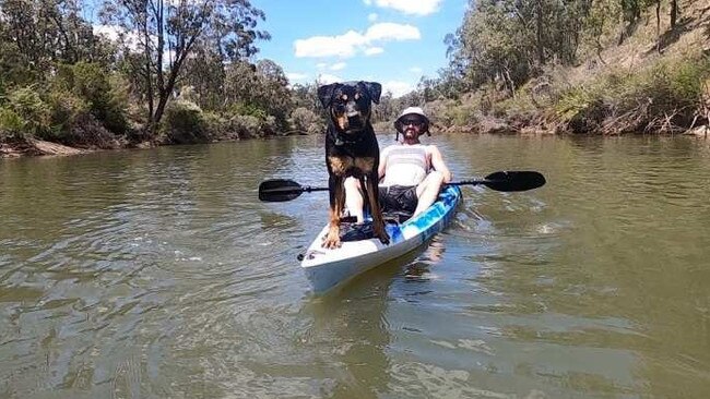 Alister MacPhee and his dog Molly before being the pair were attacked by a big croc on the Bloomfield River on Wednesday, February 22. Picture: Facebook