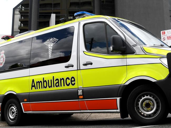 BRISBANE, AUSTRALIA - NewsWire Photos - JANUARY 13, 2021.An Ambulance leaves the Hotel Grand Chancellor in Spring Hill, Brisbane. Guests will be evacuated after six people linked to the building tested positive to the highly-contagious UK variant of the coronavirus.Picture: NCA NewsWire / Dan Peled