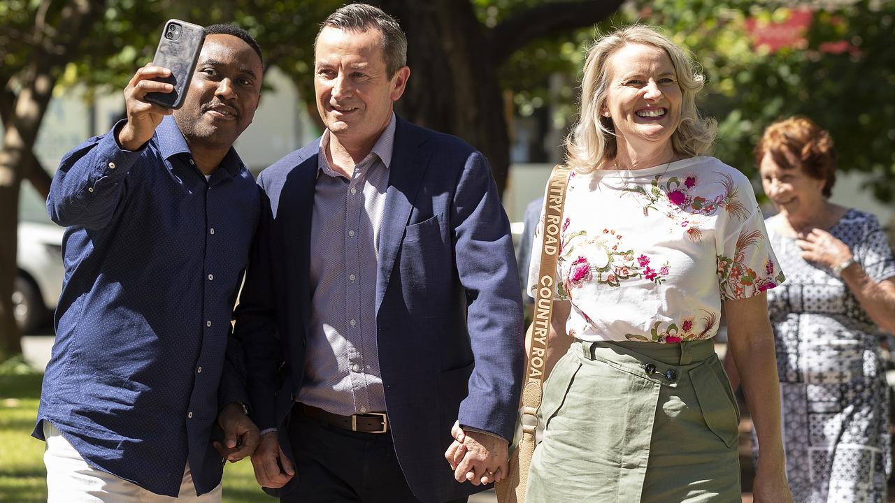 Premier Mark McGowan took selfies with the public as he walked along the boardwalk with his family in Rockingham on the morning after the state election. Picture: Will Russell/Getty Images