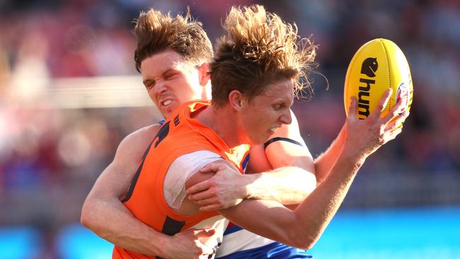 Taylor Duryea crunches Lachie Whitfield in a stinging tackle. Picture: Phil Hillyard.