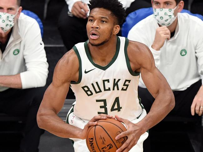 BOSTON, MASSACHUSETTS - DECEMBER 23: Giannis Antetokounmpo #34 of the Milwaukee Bucks attempts a free throw against the Boston Celtics during the first half at TD Garden on December 23, 2020 in Boston, Massachusetts. NOTE TO USER: User expressly acknowledges and agrees that, by downloading and/or using this photograph, user is consenting to the terms and conditions of the Getty Images License Agreement. (Photo by Brian Fluharty-Pool/Getty Images)