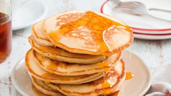 Make sure the pancakes are cooked evenly before flipping them in the pan â wait until lots of bubbles form on the surface and start to pop, then flip them.