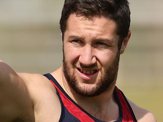 ALICE SPRINGS, AUSTRALIA - MAY 30: James Frawley gestures to fans during a Melbourne Demons AFL training session on May 30, 2014 in Alice Springs, Australia. (Photo by Michael Dodge/Getty Images)