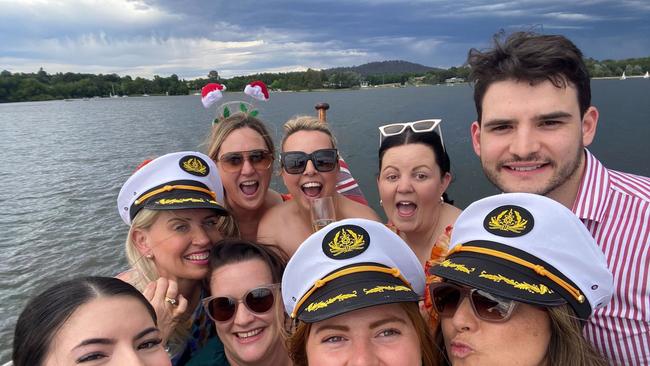 Kate Jones (in sailor hat on left) at the Akin Agency Christmas party. Akin Agency's registered lobbyist, Alex Dickson, is on the right in the striped shirt.