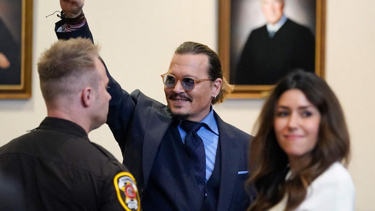 US actor Johnny Depp gestures to spectators in court after closing arguments at the Fairfax County Circuit Courthouse in Fairfax, Virginia. Picture: Steve Helber / AFP.