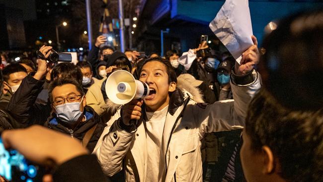 A demonstrator chants slogans during a protest in Beijing. Picture: Bloomberg.