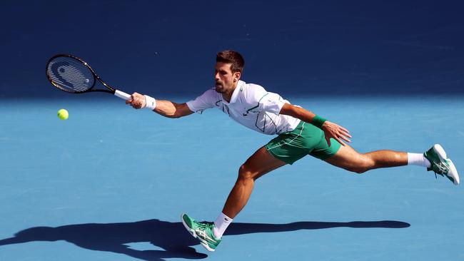 Novak Djokovic hits a return against Argentina’s Diego Schwartzman during their men’s singles match on Sunday. Picture: AFP