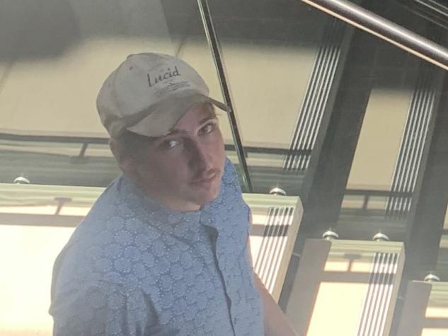 Riley John Foxley-Conolly was sentenced to 12 months' probation for evasion and driving while disqualified. (Blue shirt, black pants, wearing beige hat looking up standing on the left hand side.)