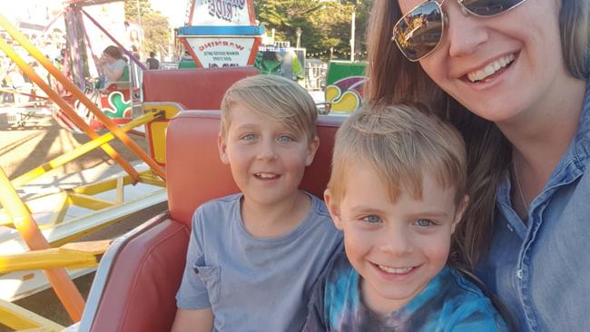 Cooper Onyett, centre, pictured with brother Jett and mother Skye, drowned while on school camp.