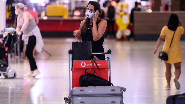 A passenger in the arrivals hall at Sydney Airport. Picture: AAP