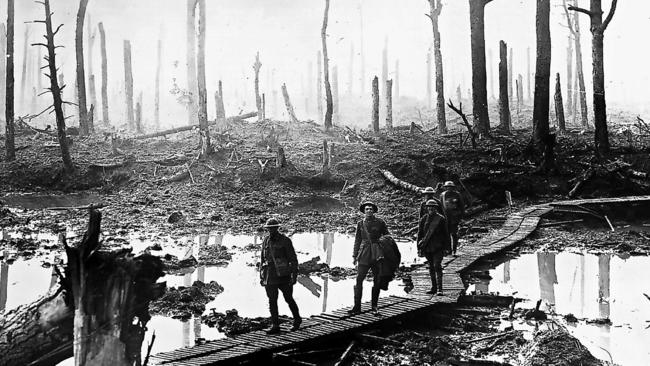 Australian soldiers cross a duckboard track winding through devastated Chateau Wood in the Ypres sector of France in 1917, during World War I. Picture: The Australian War Memorial