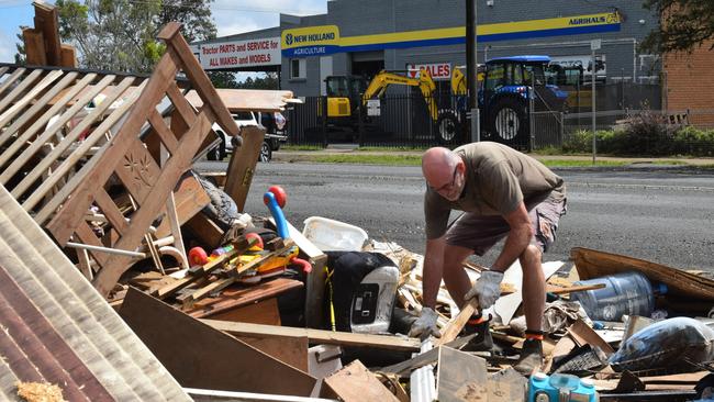 Brett O'Driscoll cleans up outside his South Lismore home which he purchased in May 2020 Picture: Nicholas Rupolo.