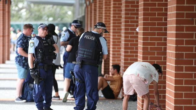 Police talk to a man with handcuffs on outside Festival X, The Dome, Homebush, Sydney. 30th November, 2019. Picture by Damian Shaw