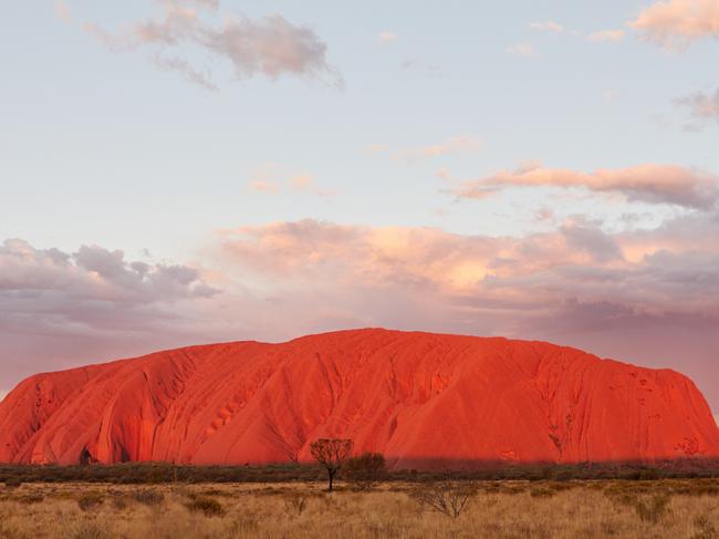 ESCAPE:  Uluru, or Ayers Rock, is a massive sandstone monolith in the heart of the Northern Territory's arid "Red Centre". The nearest large town is Alice Springs, 450km away. Uluru is sacred to indigenous Australians and is thought to have started forming around 550 million years ago. Picture: Tourism NT/Matt Cherubino