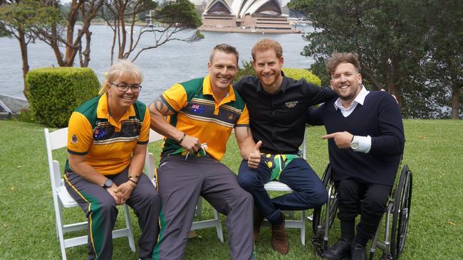 Prince Harry is presented with a pair of Aussie Invictus buggie smugglers whilst meeting Matt Model, Nicole Bradley and Dylan Alcott. Picture: ABC