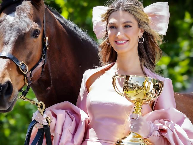 Delta Goodrem with the Melbourne Cup and 2020 winner Twilight Payment. Picture: Ian Currie