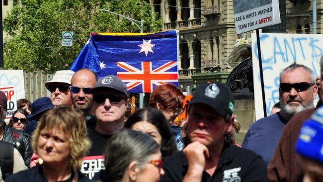 One person holds an Australian flag upside down. Picture: NCA NewsWire / Luis Enrique Ascui