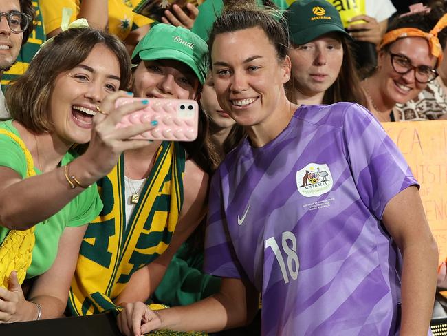 PERTH, AUSTRALIA - NOVEMBER 01: Mackenzie Arnold of Australia poses for photos with fans following the AFC Women's Asian Olympic Qualifier match between Australia and Chinese Taipei at HBF Park at HBF Park on November 01, 2023 in Perth, Australia. (Photo by Paul Kane/Getty Images)