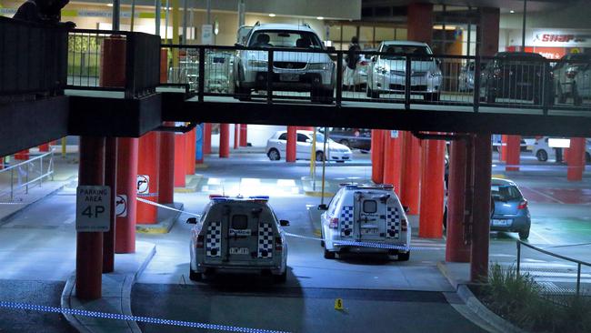 Two police cars next to evidence cones in Waverley Gardens shopping centre’s carpark. Picture: Patrick Herve