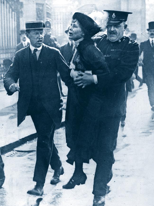 Scenes from London in the early 1900s … Police remove suffragette Emily Pankhurst from a protest outside Buckingham Palace in 1905.