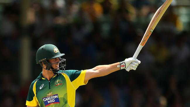Mitchell Marsh salutes the crowd after notching a half century. Picture: Paul Kane/Getty Images.