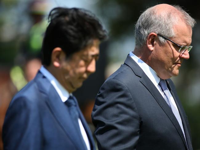 Shinzo Abe and former Australia's Prime Minister Scott Morrison at the Darwin Cenotaph in 2018.