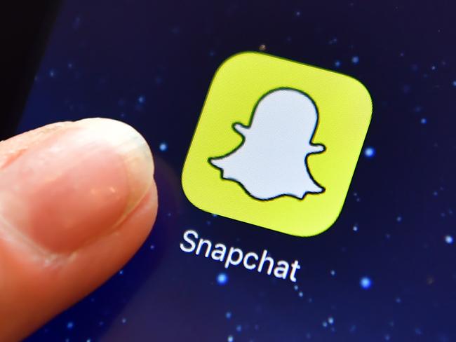 LONDON, ENGLAND - AUGUST 03: A finger is posed next to the Snapchat app logo on an iPad on August 3, 2016 in London, England.  (Photo by Carl Court/Getty Images)