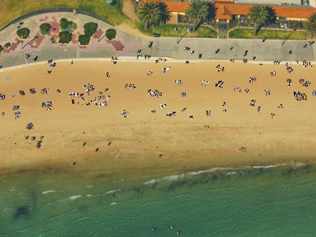 Sunseekers lie on St Kilda beach. Picture: Ben Thomas/City Shrinker