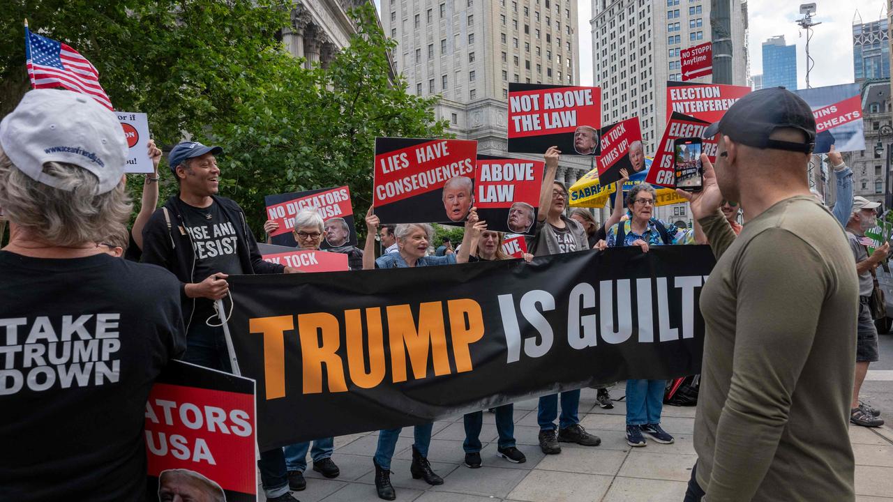 Demonstrators react moments after former US President Donald Trump was found guilty in his trial for falsifying business records in Manhattan Criminal Court in New York City on May 30. The former president was found guilty on all 34 felony counts of falsifying business records, in the first of his criminal cases to go to trial. Picture: Spencer Platt/Getty Images/AFP