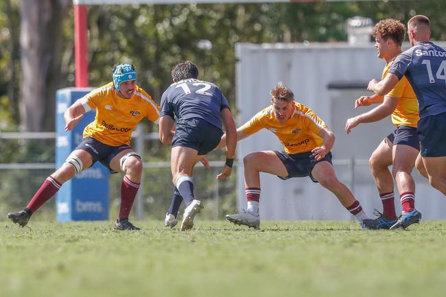 Charlie Cooke and Will Nason (right) aim up to tackle. Action from the Queensland Reds and New South Wales Waratahs under-20s academy bout. Picture: Stephen Archer.