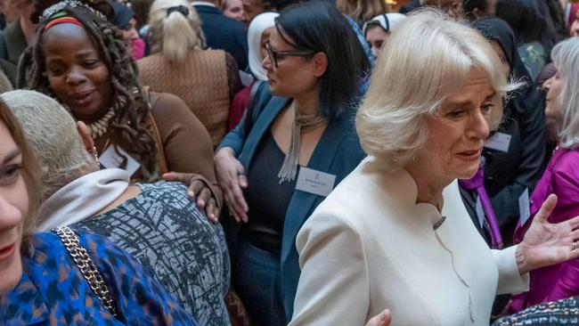 Queen Consort Camilla (R) speaks to guests near Ngozi Fulani (back L), chief executive of the London-based Sistah Space group. Picture: AFP.