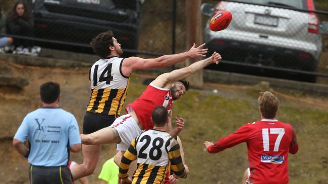 Upwey Tecoma's Liam O'Brien takes on Healesville’s Lachie Pratt. Picture: Stuart Milligan