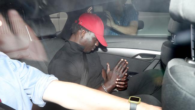 A man arrives at the Brisbane Watchhouse in relation to the murder of Girum Mekonnen at Zillmere. Picture: Tara Croser.