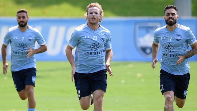 Rhyan Grant, centre, needed treatment after a head clash against Melbourne City on Sunday Picture: AAP